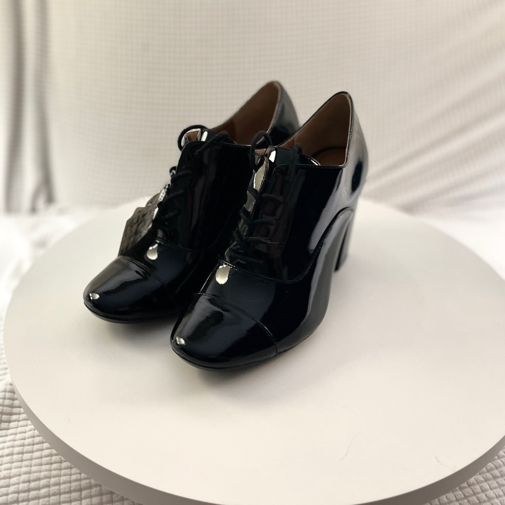 Calvin Klein black patent leather Oxford Booties. NWT. Size 6.